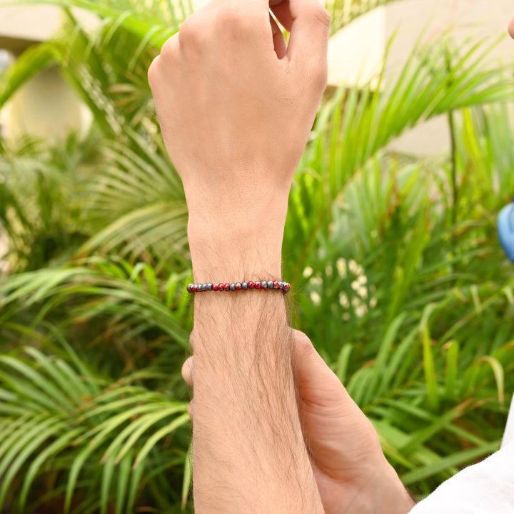 Red Gray Hematite Stretch Rondelle Bracelet: Smooth 4mm beads in dynamic red and gray hues