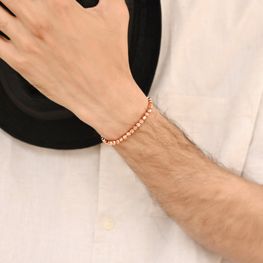 Rose Gold Hematite Bicone Stretch Bracelet: Smooth 4mm bicone beads in radiant rose gold hue.