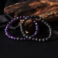 Artistic close-up of the Natural Amethyst & Lava Gemstone Bracelet. A captivating shot capturing the royal purple hues of Amethyst and the raw elegance of lava gemstones, creating a unique and eye-catching composition.