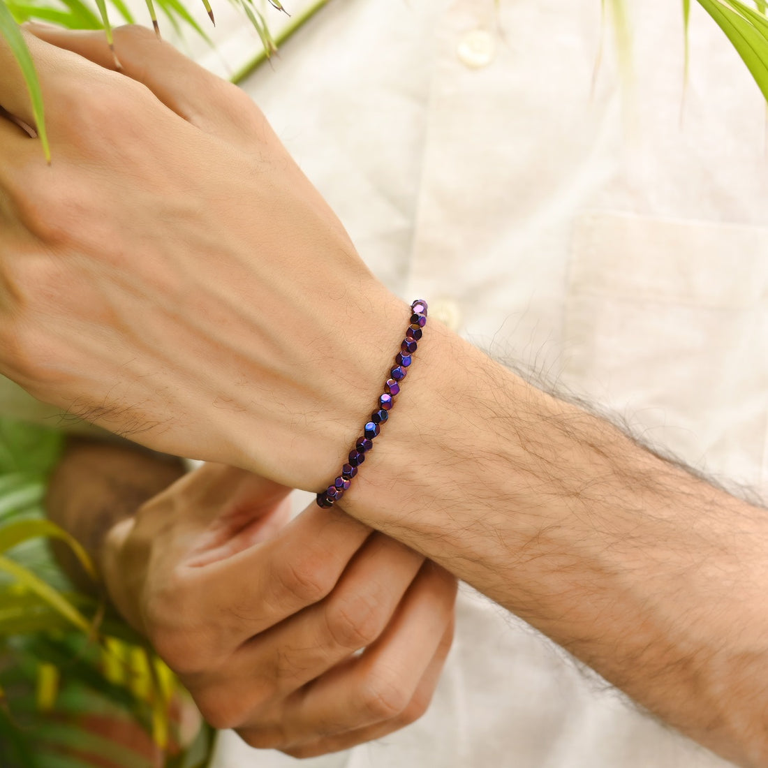 Ethereal Purple Hematite Star Cut Stretch Bracelet: Smooth 4mm star cut beads in captivating purple hue