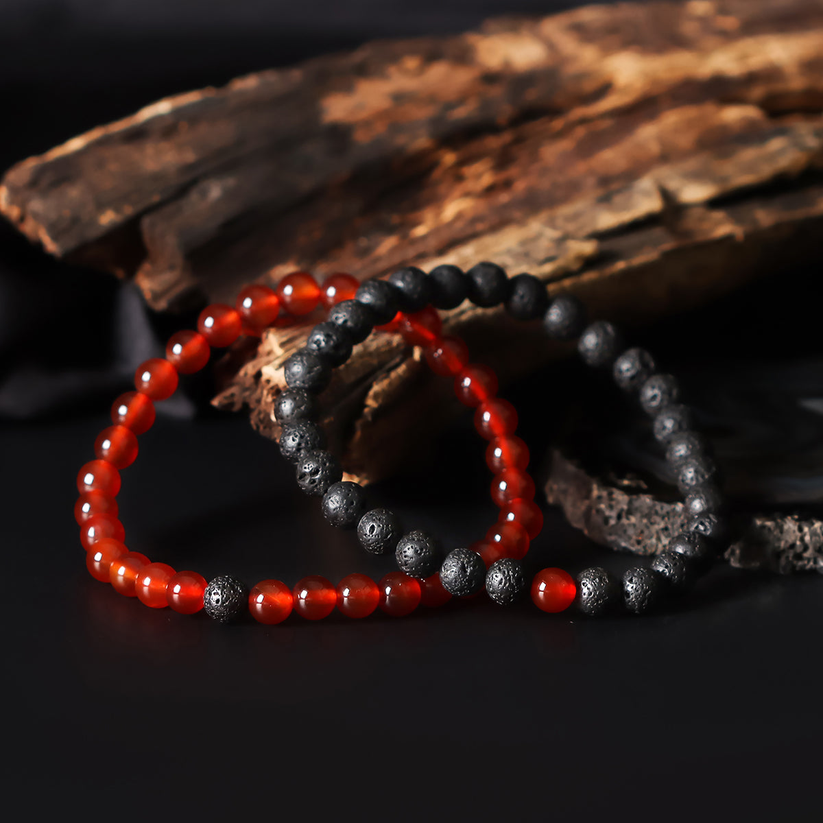 Artistic close-up of the Natural Red Onyx & Lava Gemstone Bracelet. A captivating shot capturing the rich red hues of Onyx and the raw elegance of lava gemstones, creating a unique and eye-catching composition.