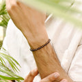 Brown Hematite Stretch Bracelet: Smooth round 4mm beads in rich brown hue
