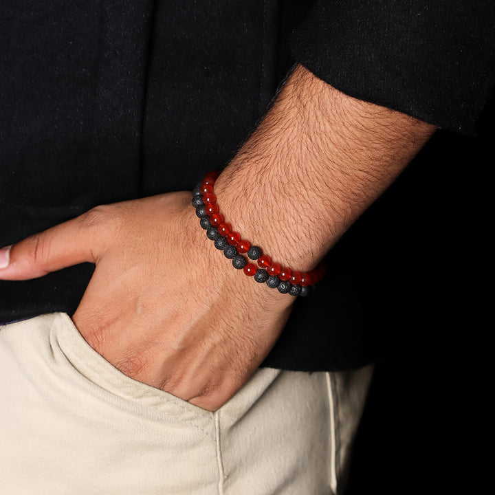 Natural Red Onyx & Lava Gemstone Bracelet. Emphasis on the wrist, highlighting the 6mm beads for a bold and sophisticated look.