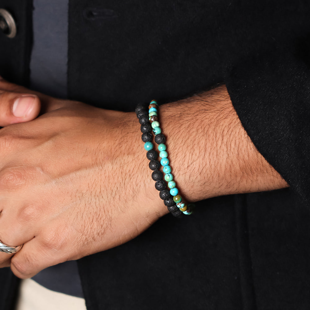 Natural Turquoise & Lava Gemstone Bracelet. Emphasis on the wrist, highlighting the 6mm beads for a vibrant and sophisticated look.