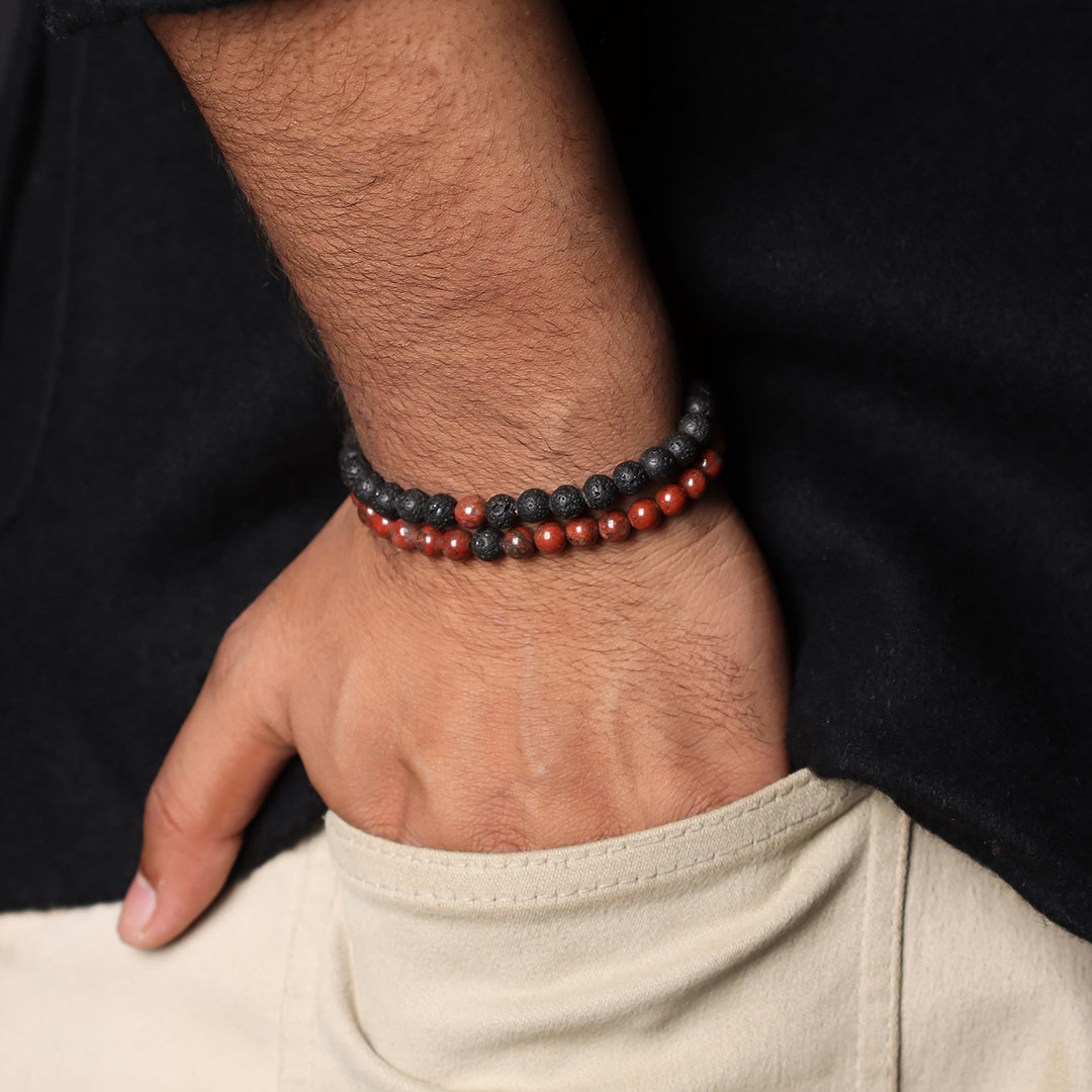 Natural Red Jasper & Lava Gemstone Bracelet. Focus on the wrist, highlighting the 6mm beads for a bold and sophisticated look.