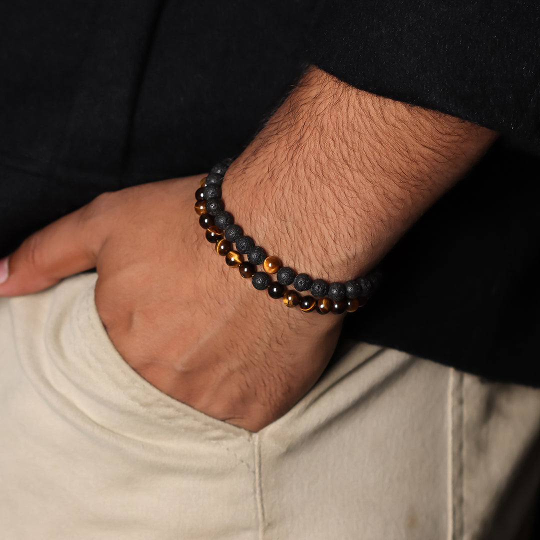 Natural Tiger's Eye & Lava Gemstone Bracelet. Emphasis on the wrist, highlighting the 6mm beads for a refined and empowering look.