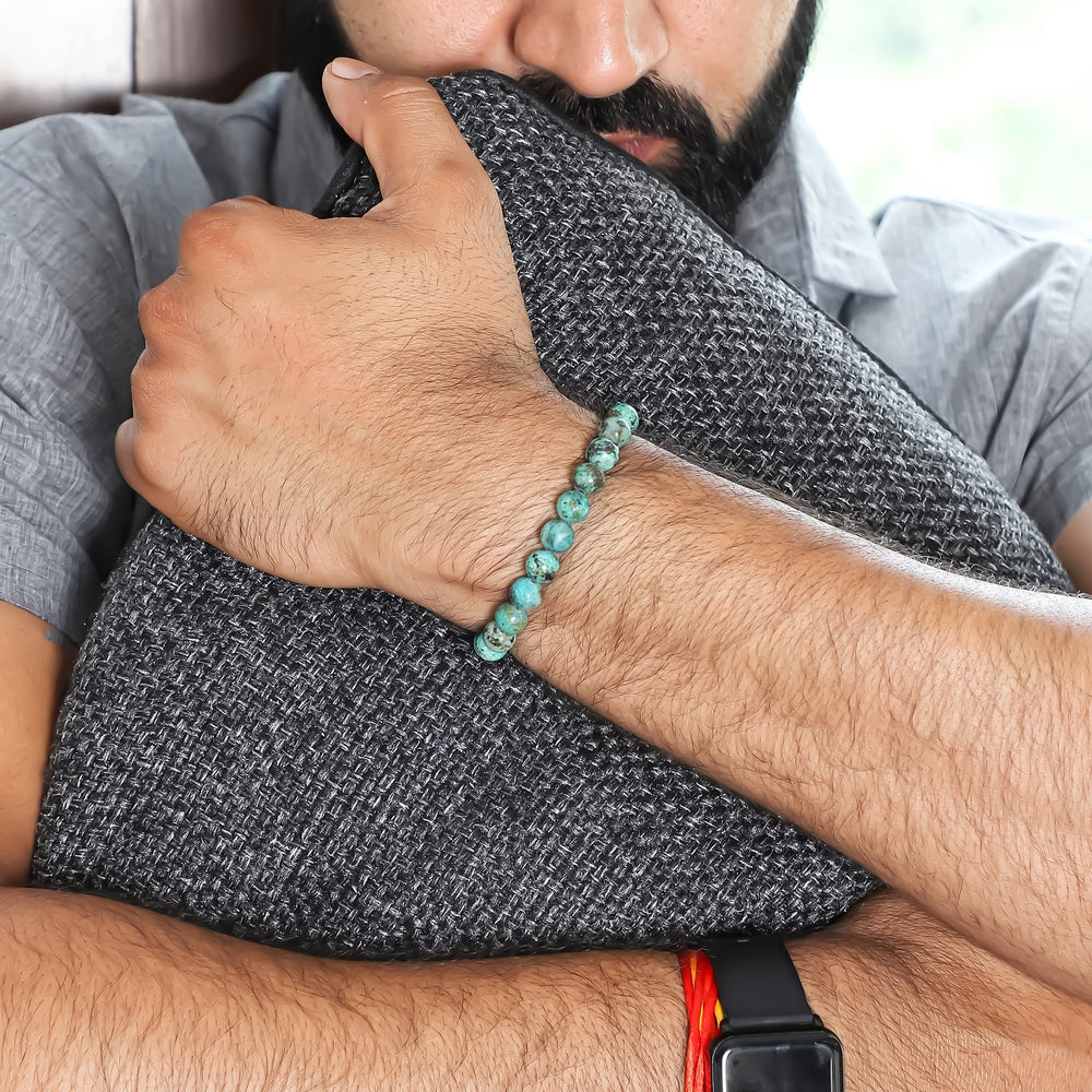 A wrist shot capturing the turquoise bead bracelet worn elegantly, showcasing how the bracelet adds a touch of charm to various styles.