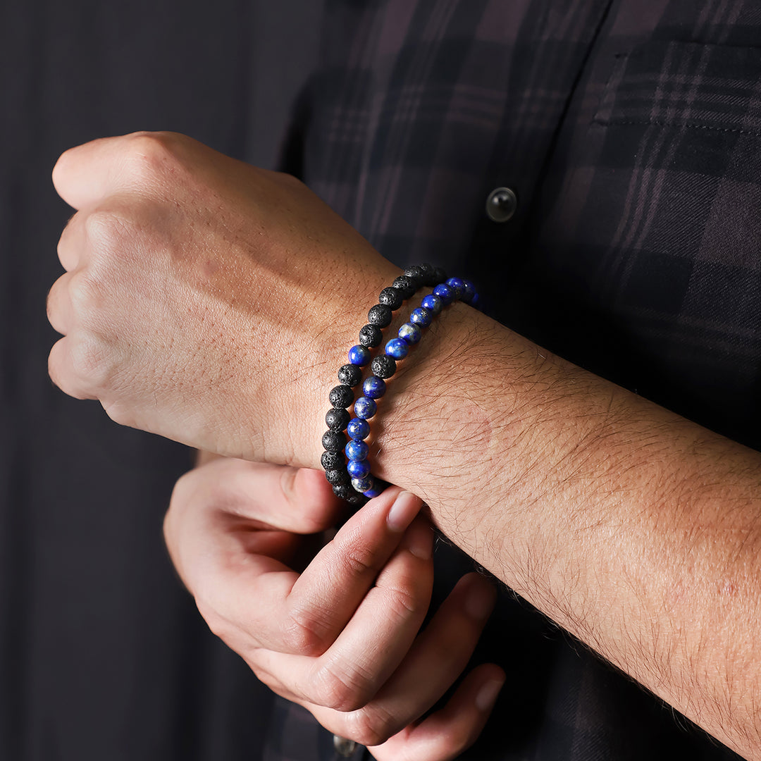 Natural Lapis Lazuli & Lava Gemstone Bracelet. Emphasis on the wrist, highlighting the 6mm beads for a refined and regal look.