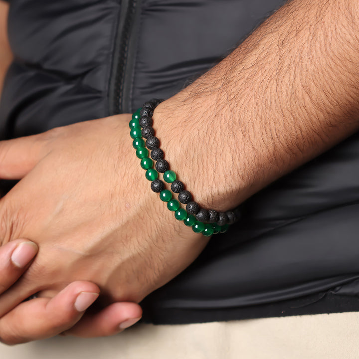 Natural Green Onyx & Lava Gemstone Bracelet. Emphasis on the wrist, highlighting the 6mm beads for a sophisticated and harmonious look.