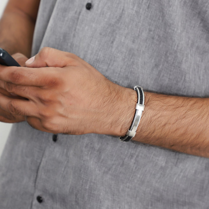 Wrist shot of the bracelet elegantly styled with formal attire, showcasing its versatility