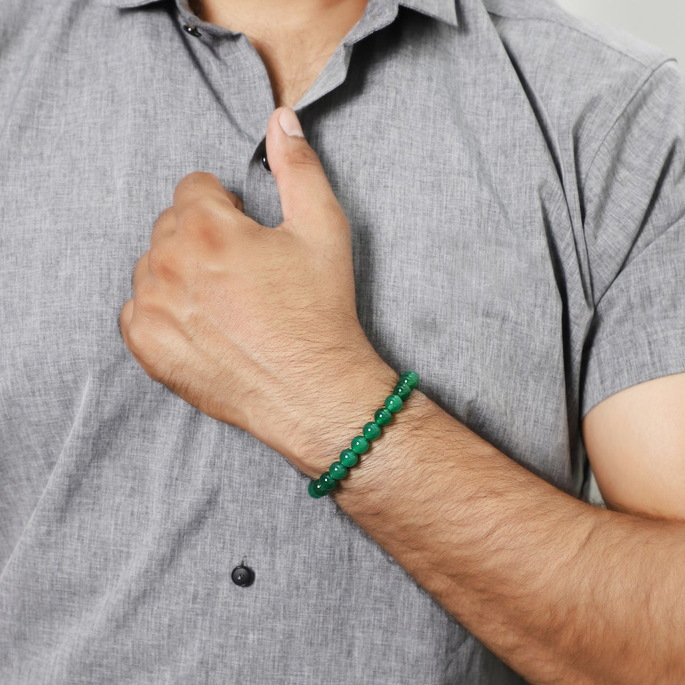 Wrist shot of the bracelet stylishly paired with nature-inspired attire, reflecting its vibrant essence