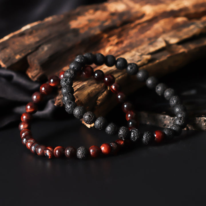 Artistic close-up of the Red Tiger's Eye & Lava Gemstone Bracelet. A captivating shot capturing the fiery red hues of Tiger's Eye and the raw elegance of lava gemstones, creating a unique and eye-catching composition.