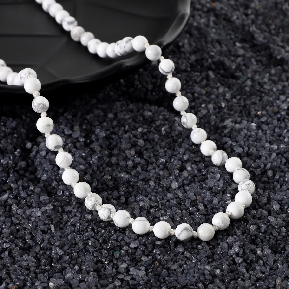 Close-up of Howlite Gemstone beads, revealing the intricate details and smooth texture for a tactile meditation experience