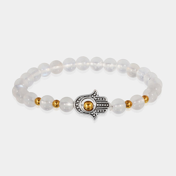 A bracelet adorned with smooth round Rainbow Moonstone beads, reflecting iridescent shades of white and promoting intuition and emotional balance.