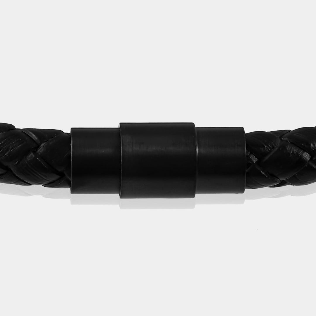 Focus on the detailed braided leather weaving, showcasing the craftsmanship of the bracelet