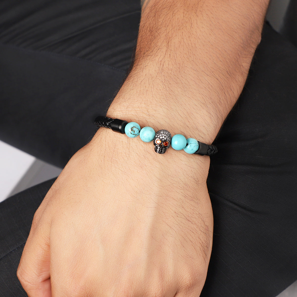 Wrist shot of the bracelet stylishly paired with an edgy outfit, capturing its unique charm