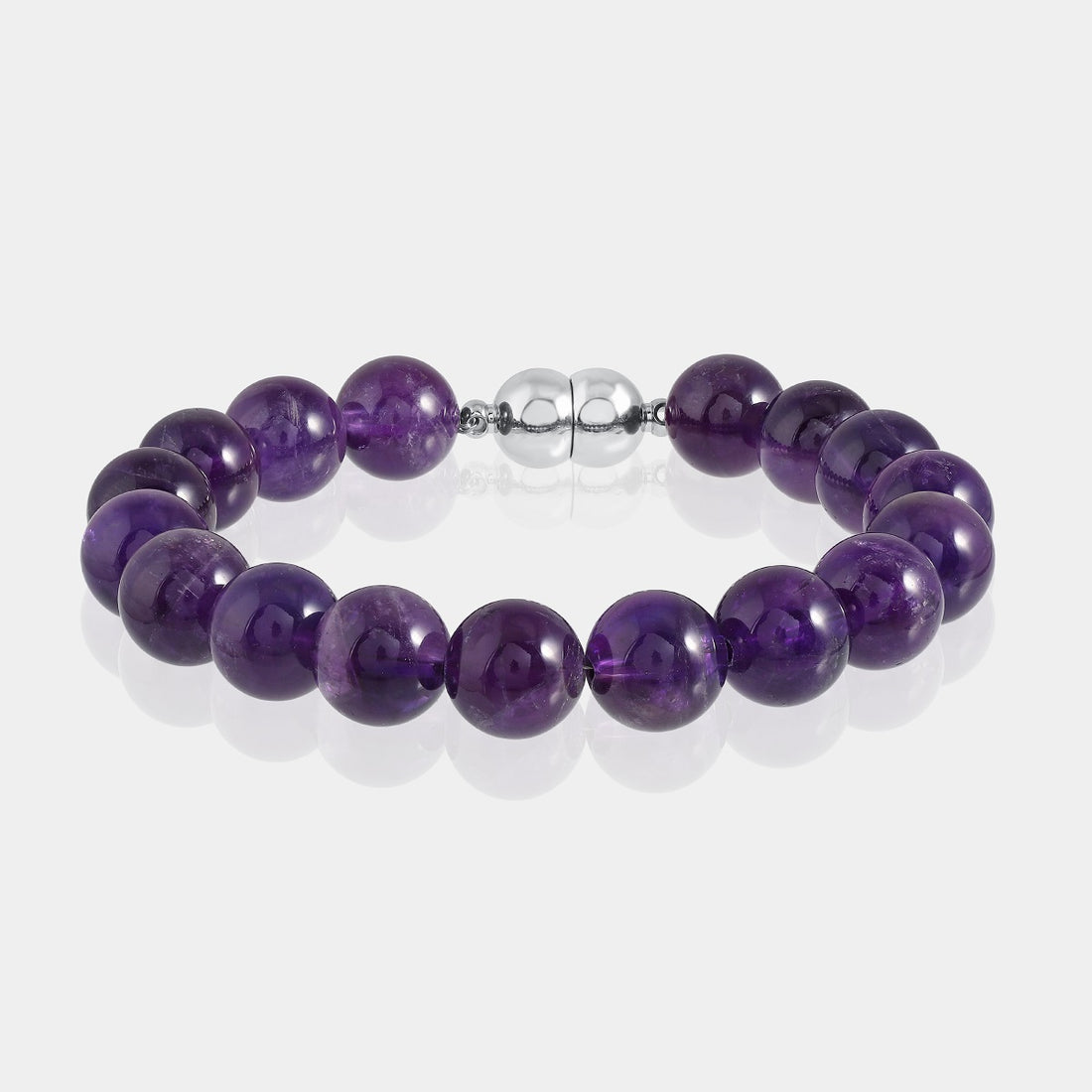 A close-up of a handmade bracelet featuring smooth round amethyst gemstone beads in a rich shade of purple, elegantly strung together
