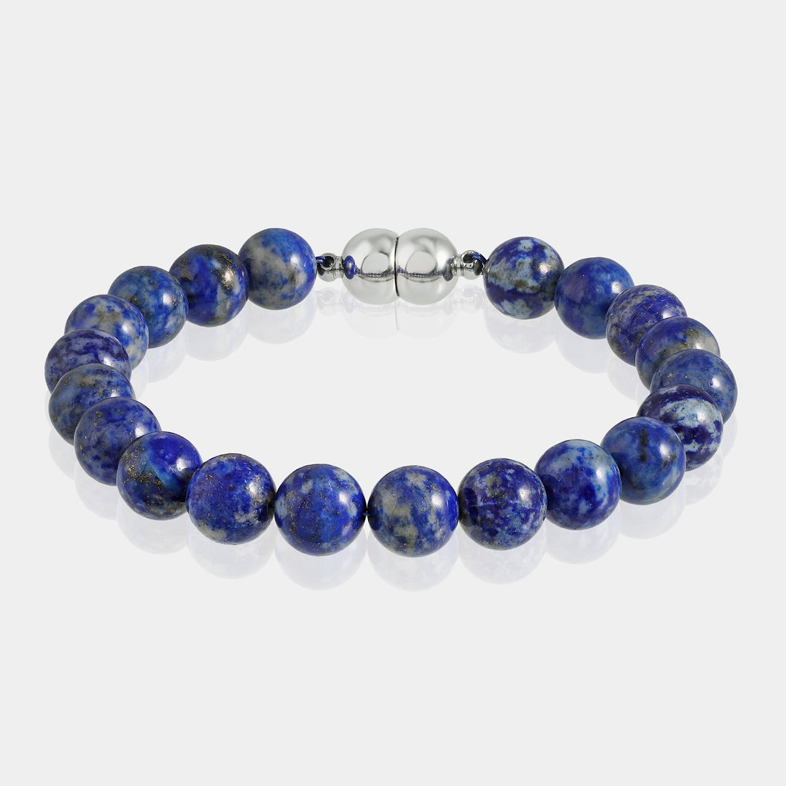 A close-up of a handmade bracelet adorned with smooth round lapis lazuli gemstone beads, showcasing its deep blue color and elegance.
