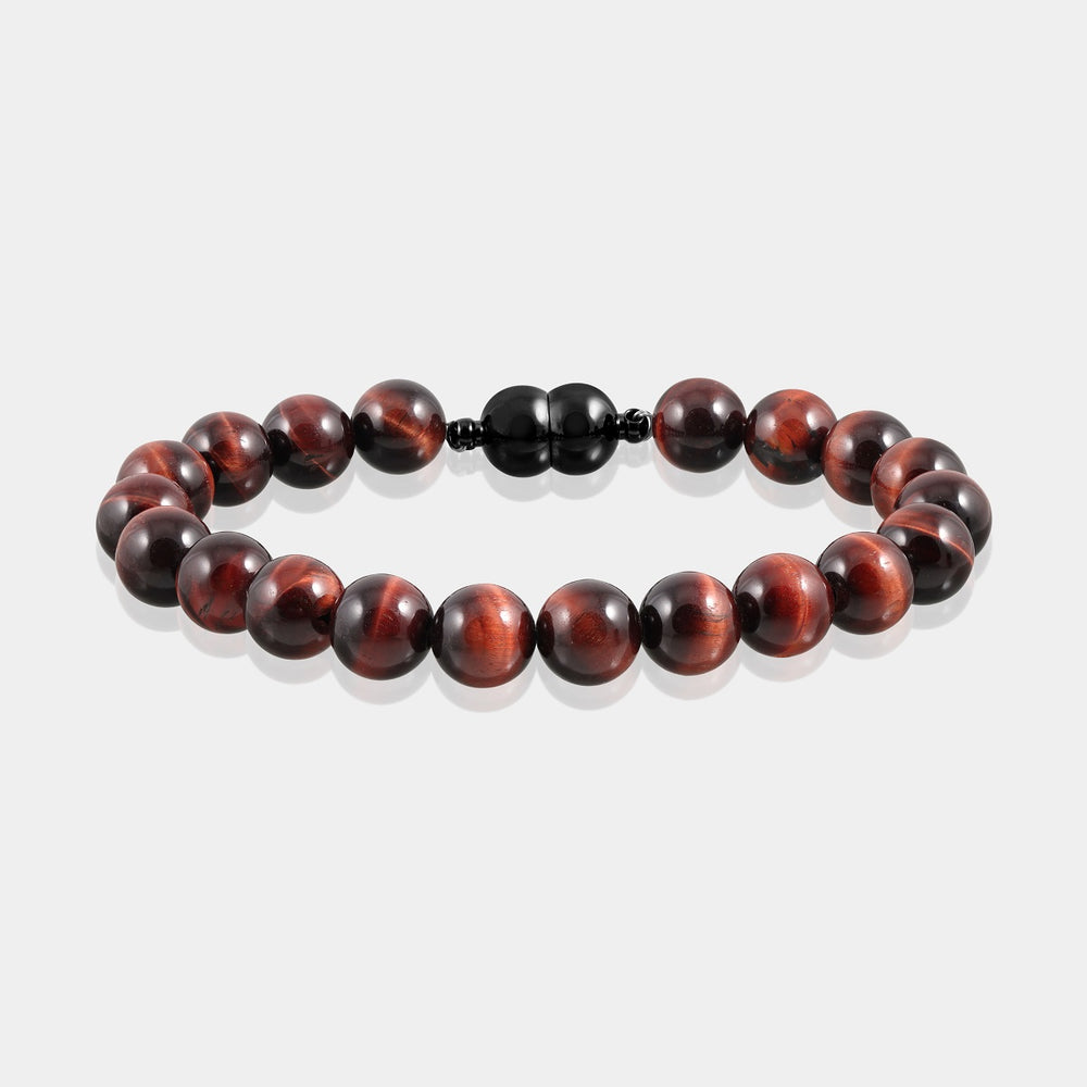 A close-up of a handmade bracelet featuring smooth round red tiger's eye gemstone beads, showcasing their captivating play of colors.