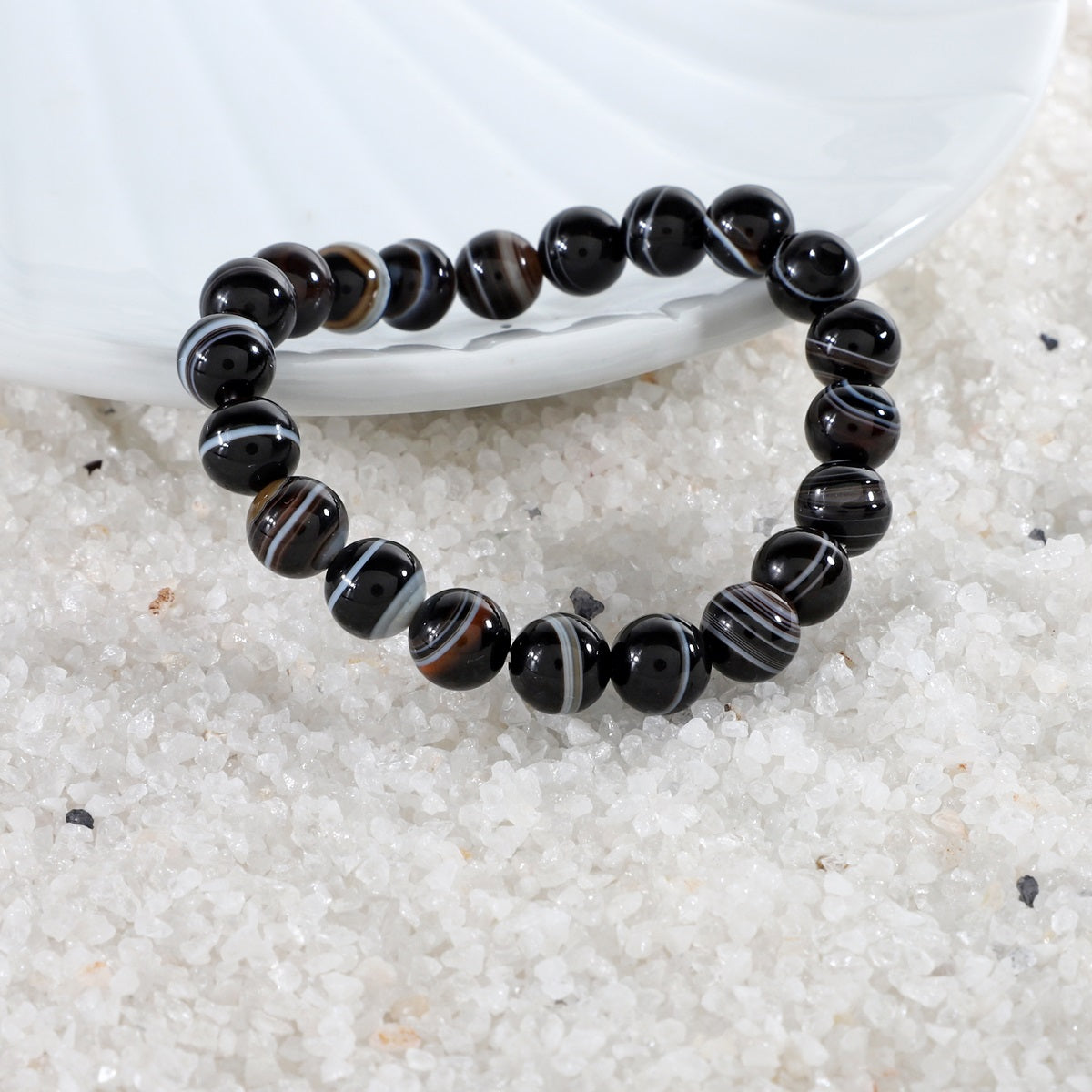 Black Banded Agate 8mm Round Beads Stretch Bracelet showcased in versatile styling options, emphasizing its adaptability for various occasions