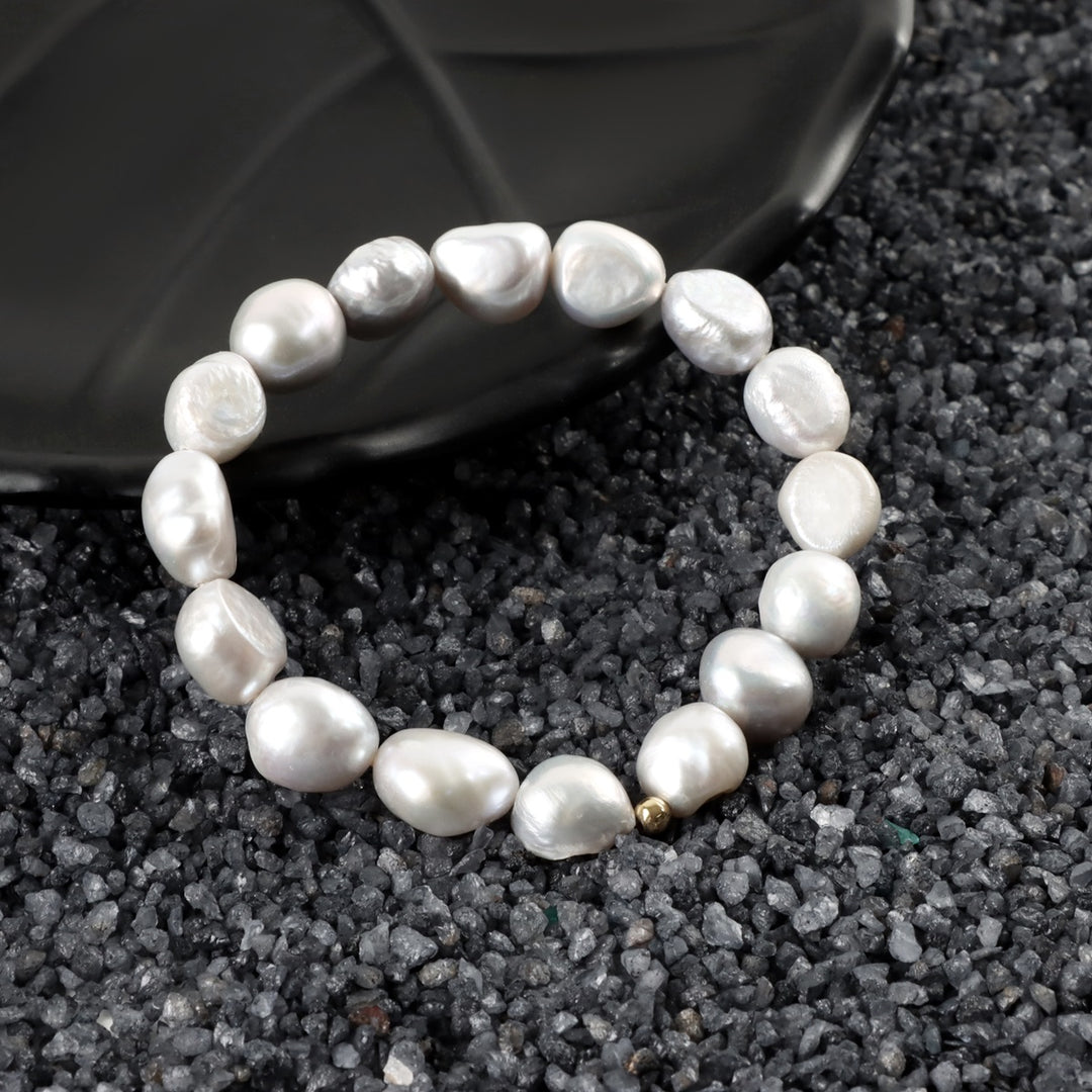 Array of Smooth Tumble Pearls, Showcasing Elegant Gray Hue