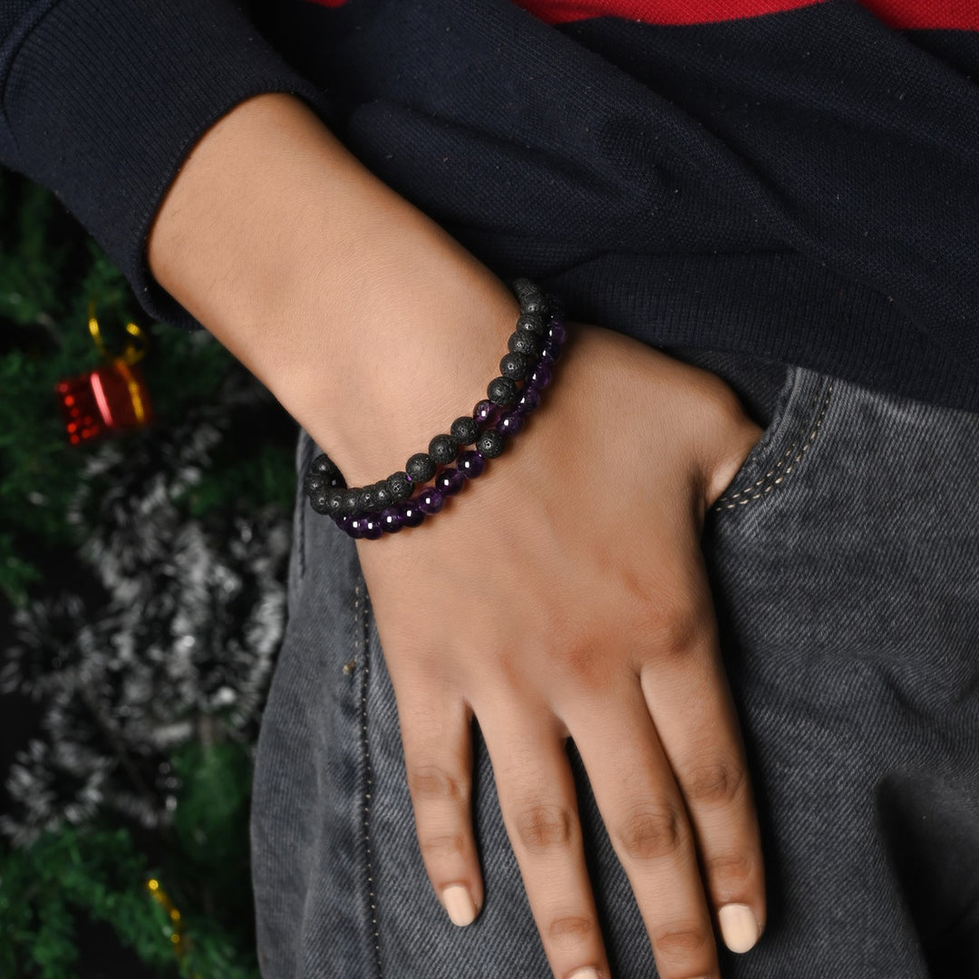 Natural Amethyst & Lava Gemstone Bracelet. Focus on the wrist, highlighting the 6mm beads for a refined and regal look.