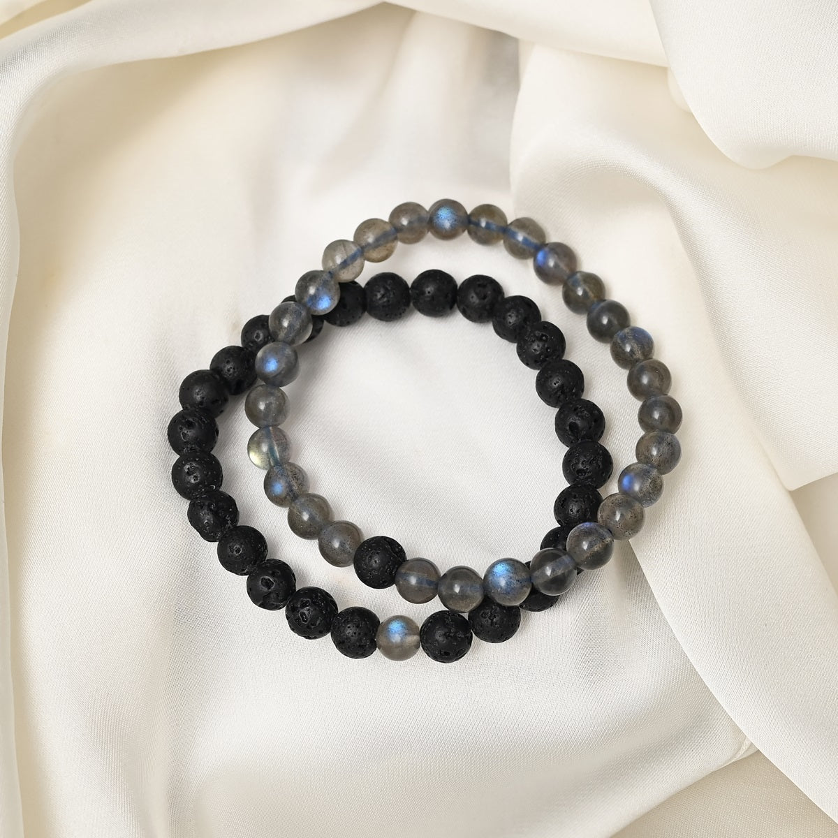 Detailed close-up showcasing the intricate beauty of gray Labradorite and black Lava gemstones in our exquisite bracelet