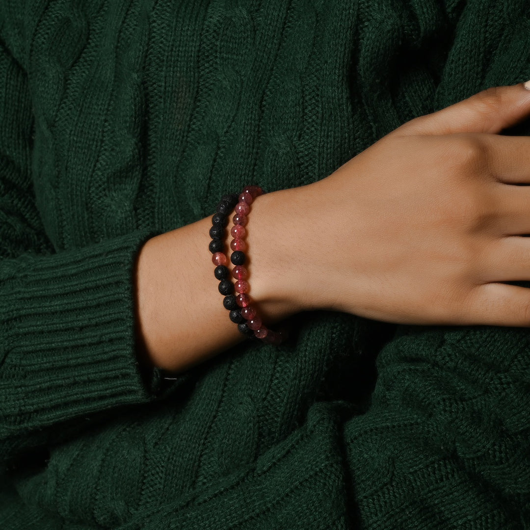 Elegant Strawberry Quartz and Lava gemstone bracelet adorning the wrist, a harmonious blend of style and healing energies.