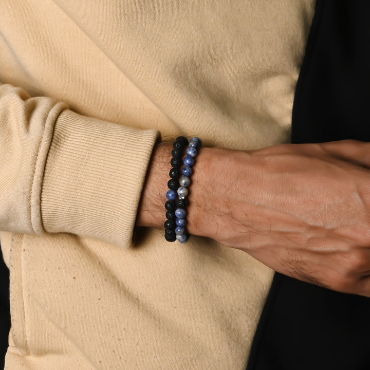 Elegant Blue Spot Jasper and Lava gemstone bracelet adorning the wrist, a harmonious blend of style and healing energies.