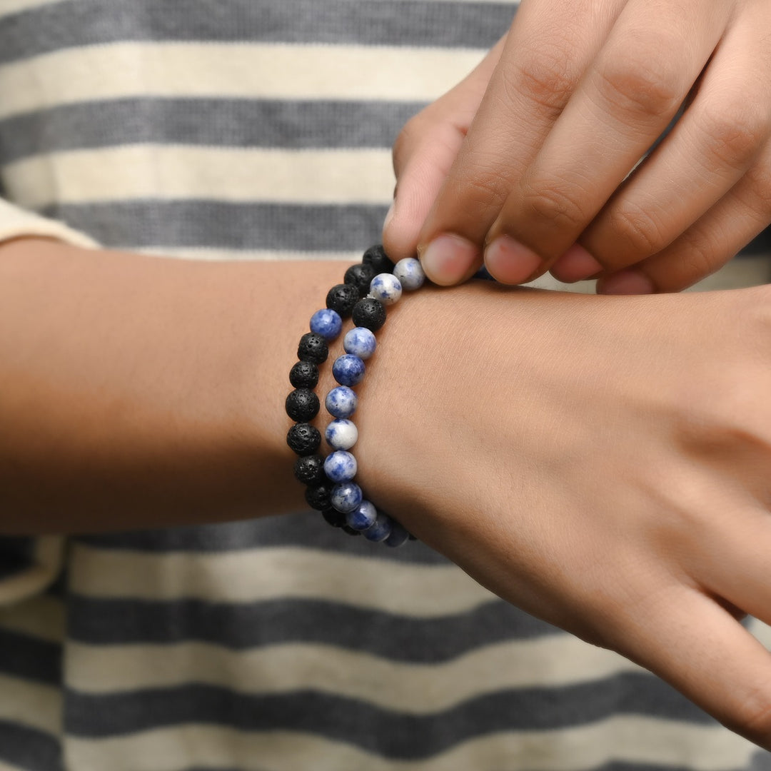 Elegant Blue Spot Jasper and Lava gemstone bracelet adorning the wrist, a harmonious blend of style and healing energies.