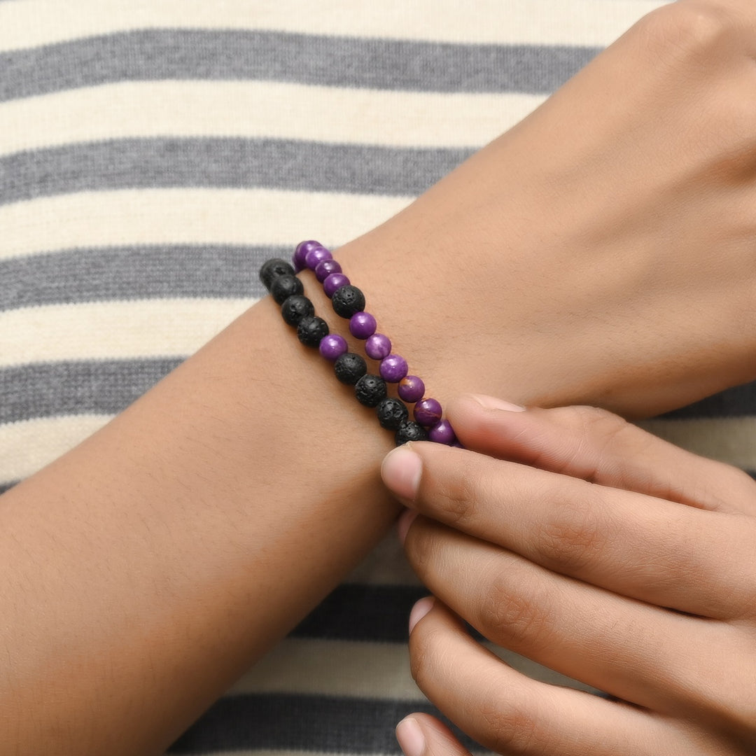 Elegant Lepidolite and Lava gemstone bracelet adorning the wrist, a harmonious blend of style and healing energies