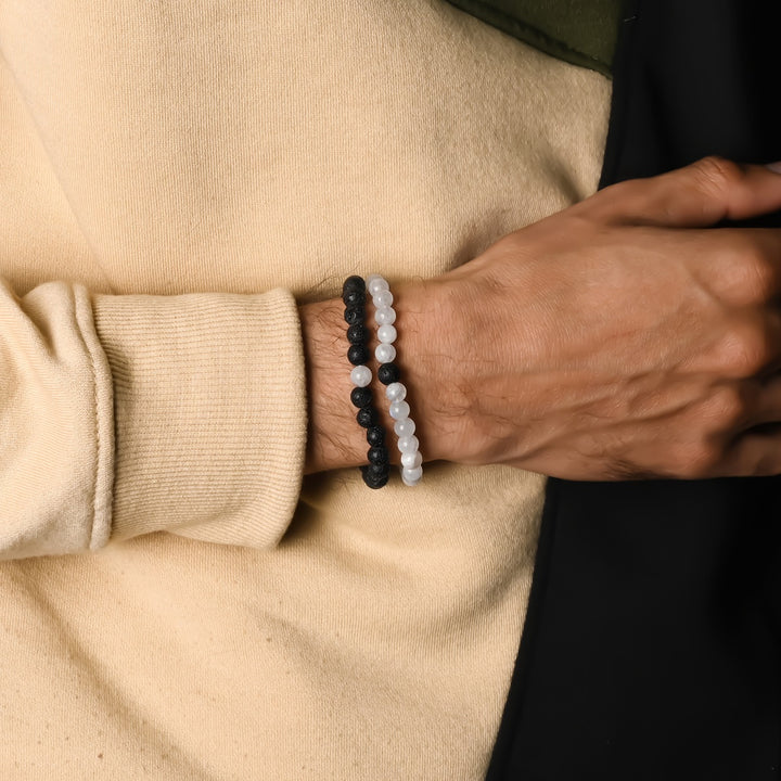 Elegant Rainbow Moonstone and Lava gemstone bracelet adorning the wrist, a harmonious blend of celestial beauty and grounding energies.