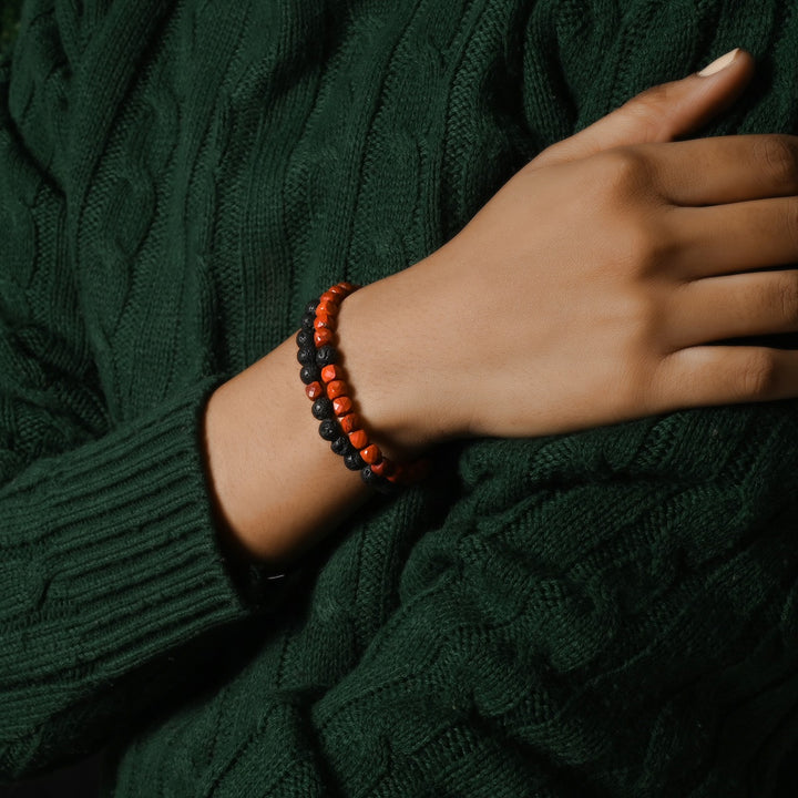 Natural Red Jasper & Lava Gemstone Bracelet. Focus on the wrist, highlighting the 6mm beads for a bold and sophisticated look.