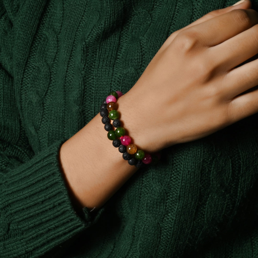 Elegant Multi Tourmaline Quartz and Lava gemstone bracelet adorning the wrist, a harmonious blend of vibrant energy and grounding effects.