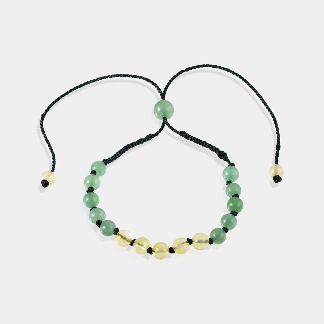 Detailed shot showcasing 6 mm smooth round Green Aventurine gemstone beads, representing luck, confidence, and overall well-being