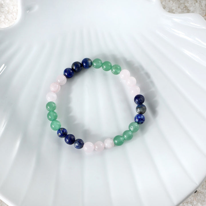 Vibrant image showcasing the 6 mm smooth round Green Aventurine gemstone beads, representing luck and prosperity