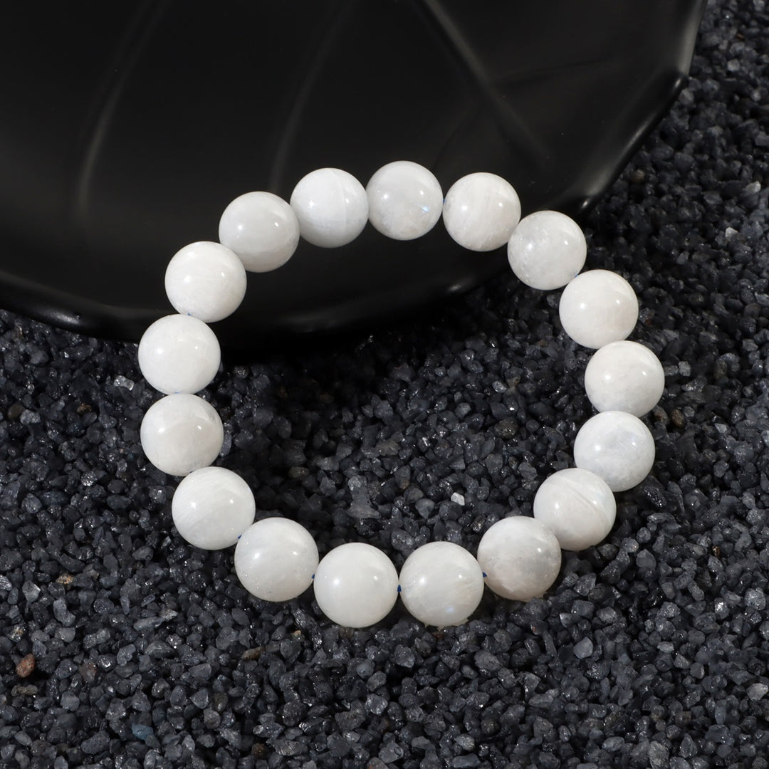 Elegant arrangement of Rainbow Moonstone beads, symbolizing divine feminine energy and timeless elegance