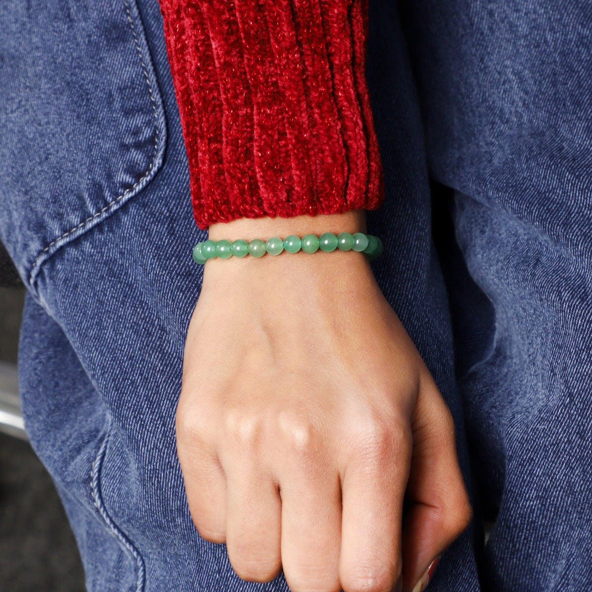 Stylish shot featuring the Green Aventurine Bracelet with 6mm smooth round beads, radiating prosperity and opportunity