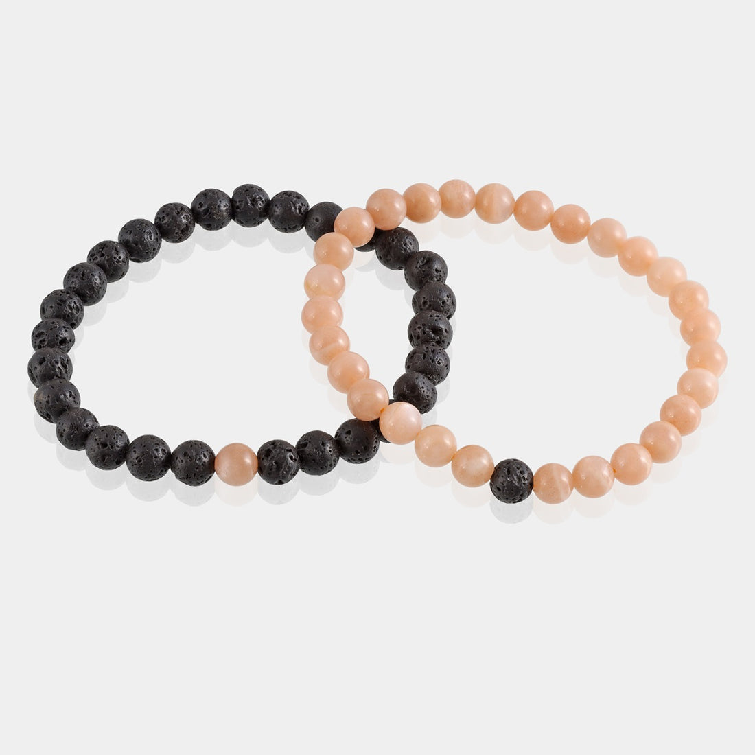 Stylish Peach Moonstone and Lava Bracelet featuring 6mm beads, a harmonious fusion of elegance, emotional healing, and grounding energy on the wrist