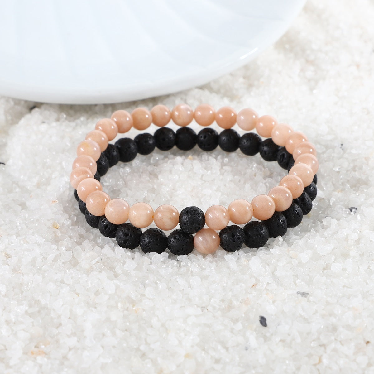 Visual representation of harmonious energy associated with the Peach Moonstone and Lava Bracelet Combo, combining elegance and emotional healing