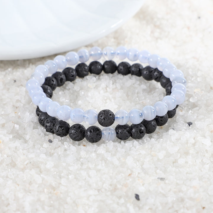 Visual representation of harmonious energy associated with the Blue Lace Agate and Lava Gemstone Bracelet Combo, combining elegance and grounding strength