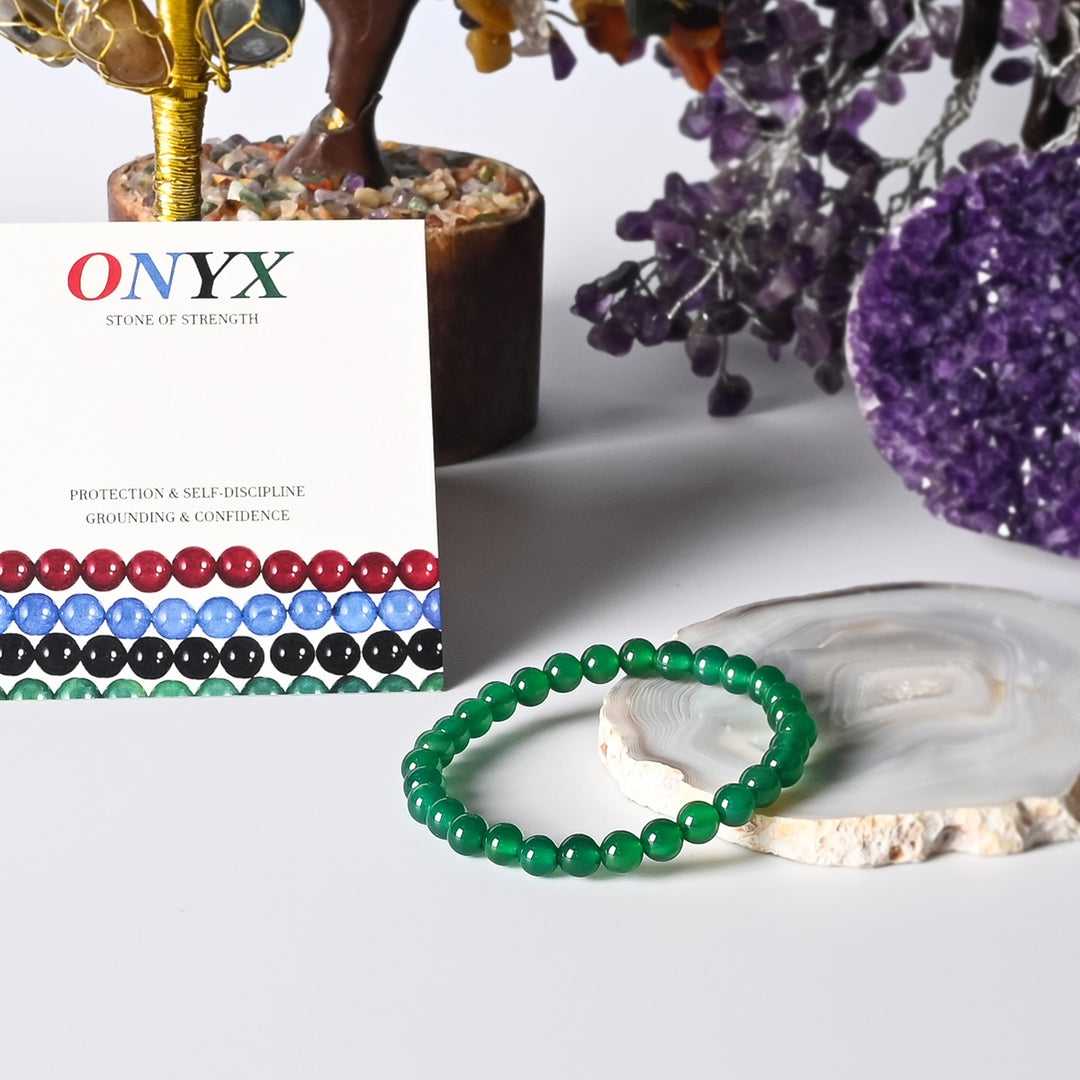 Visual representation of prosperity and abundance associated with the Green Onyx Stretch Bracelet, radiating positive energy and success.