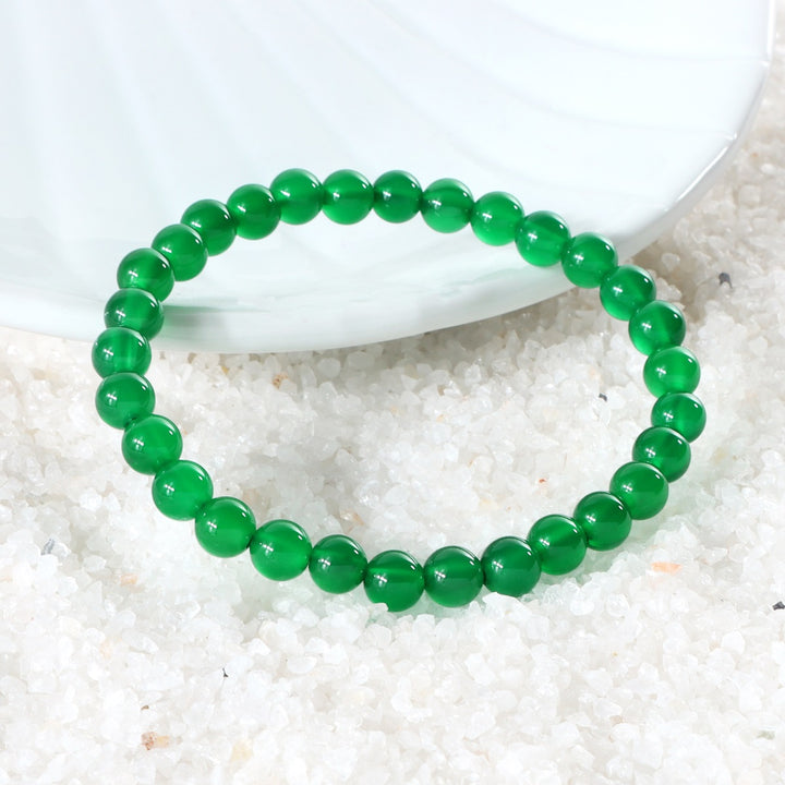 Various styling ideas for the Green Onyx Stretch Bracelet, showcasing its versatile and fashionable appeal for everyday wear