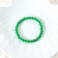 Various styling ideas for the Green Onyx Stretch Bracelet, showcasing its versatile and fashionable appeal for everyday wear