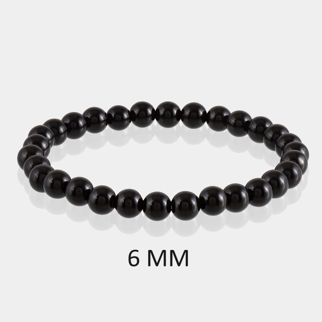 Symbolic image representing the protective qualities of Black Tourmaline, shielding against negativity, portrayed elegantly in the bracelet
