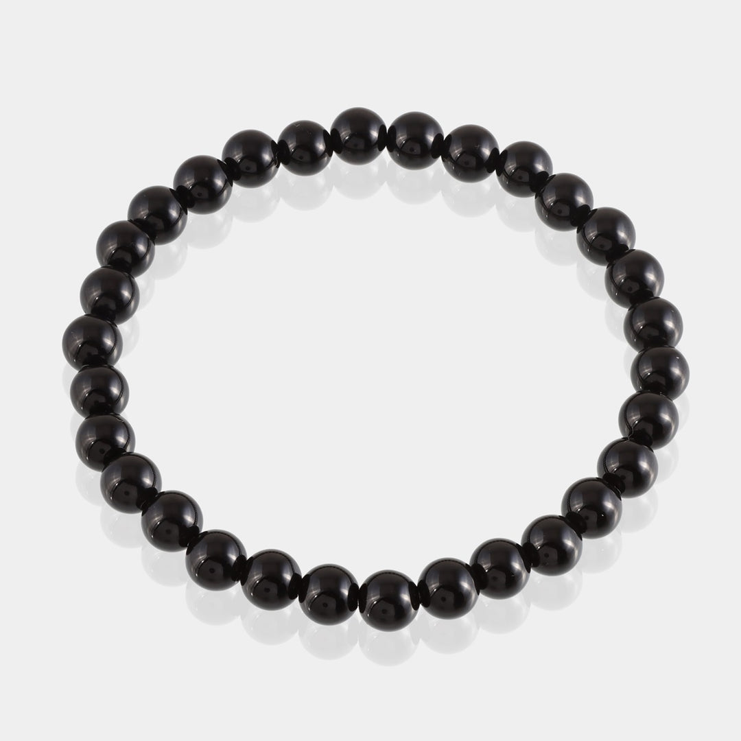 Visual representation of grounding energy associated with Black Tourmaline, fostering stability and security, showcased in the bracelet