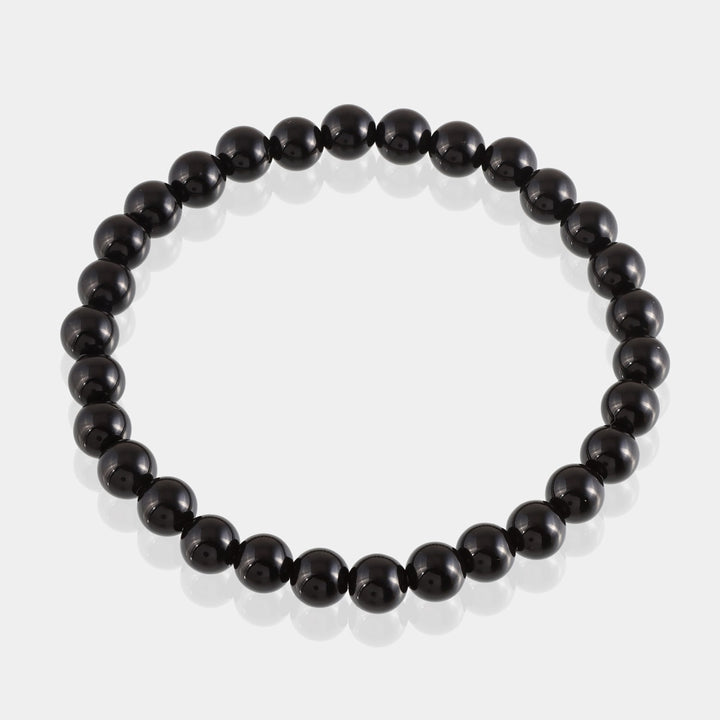 Visual representation of grounding energy associated with Black Tourmaline, fostering stability and security, showcased in the bracelet