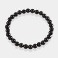 Elegant Black Onyx Bracelet with 6mm and 8mm smooth round stones, radiating strength and grounding energy