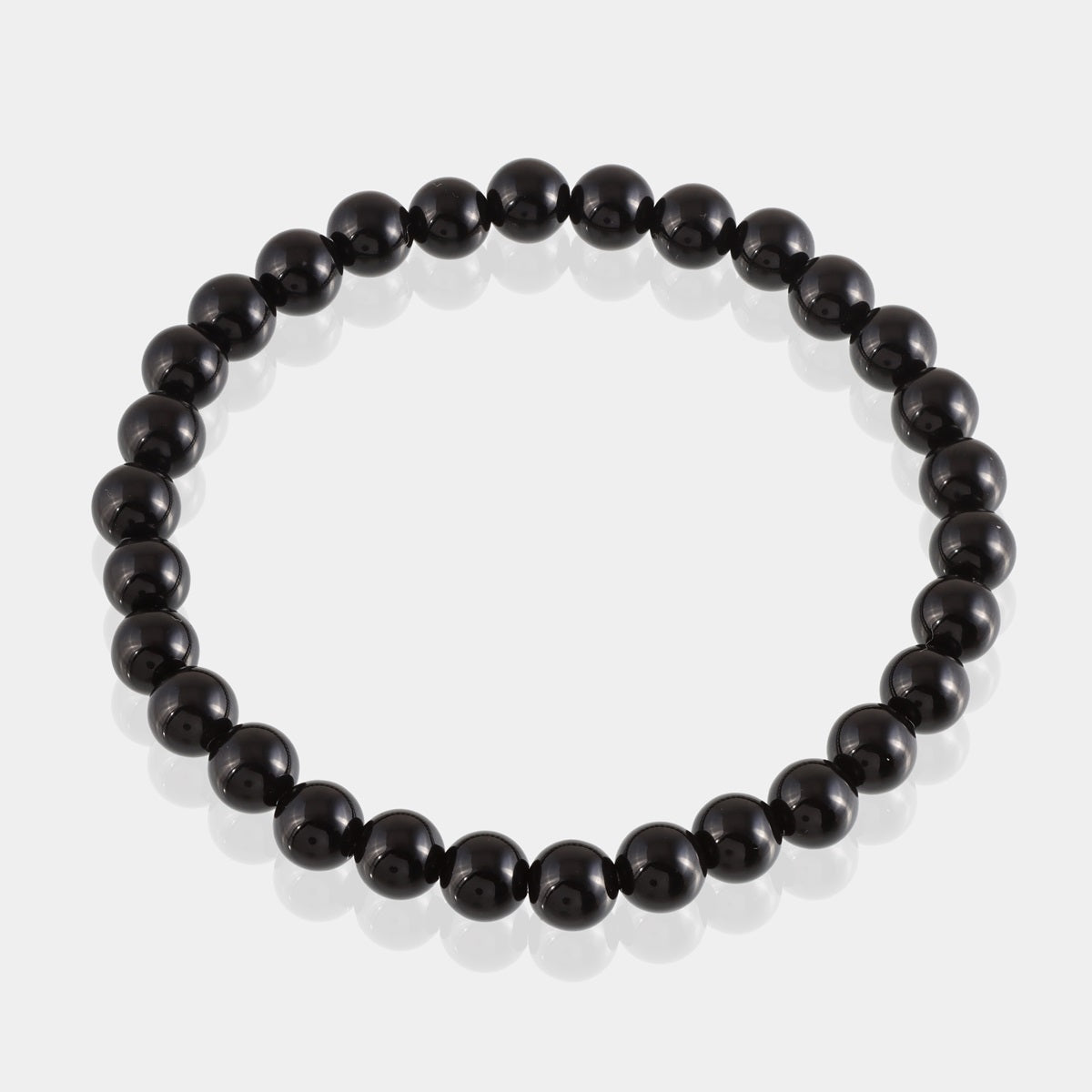 Elegant Black Onyx Bracelet with 6mm and 8mm smooth round stones, radiating strength and grounding energy
