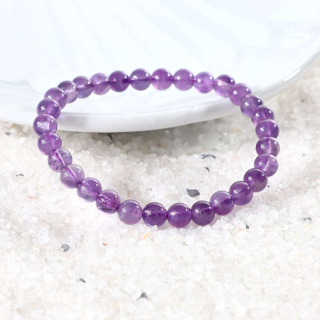 Various styling ideas for the Amethyst Stretch Bracelet, showcasing its versatile and fashionable appeal for everyday wear